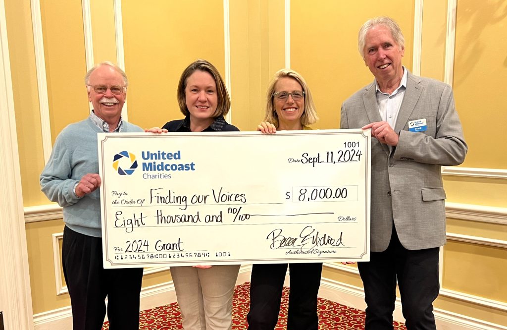 Giving out grants at the grantee breakfast