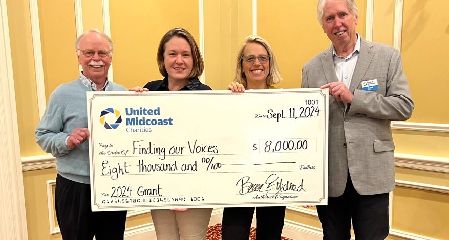 Giving out grants at the grantee breakfast